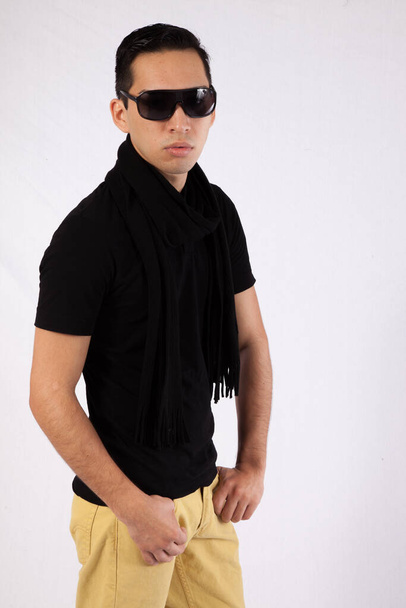 Pensive man with black shirt and sunglasses - Foto, imagen