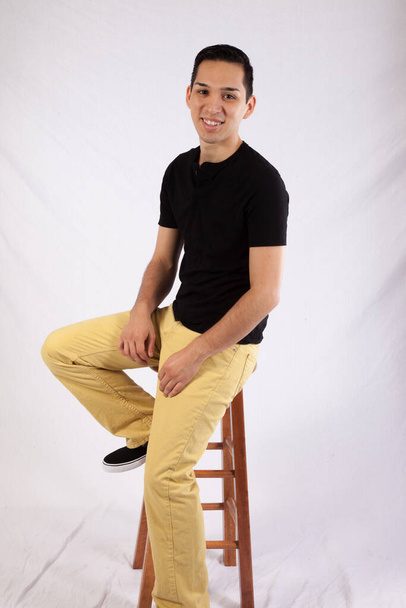 Happy man sitting on a stool - Photo, Image