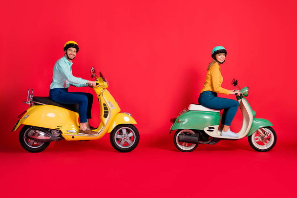Profile side view of her she his he nice attractive friendly cheerful cheery couple practicing driving skills traveling isolated on bright vivid shine vibrant red color background - Foto, imagen