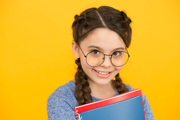 Get ready for classes. Inspiring education. Private schooling. Cute smiling schoolgirl. Girl little schoolgirl. Pupil with braids going to school. Schoolgirl daily life. School club. Library concept - Photo, image
