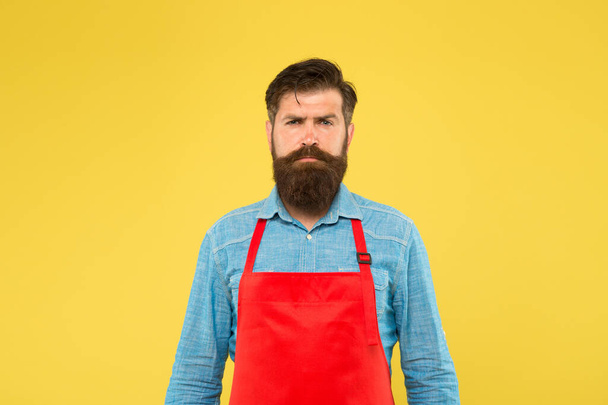 professional chef in red apron. restaurant staff wanted. cooking is his hobby. bearded man in cook uniform. confident male housekeeper. Small business shop owner. mature shop assistant - Фото, изображение