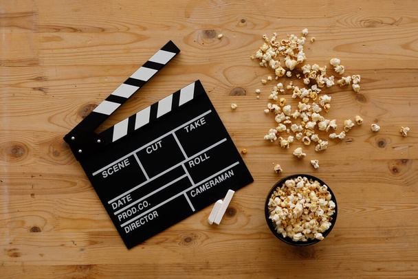 Filmmaking concept. Movie Clapperboard. Cinema begins with movie clappers. Top view. Copy space. Place for your text. - Photo, image