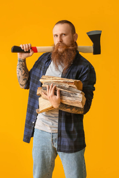 Handsome lumberjack on color background - Photo, Image
