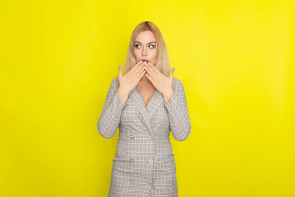 Attractive blonde woman in plaid jacket dress - Fotoğraf, Görsel