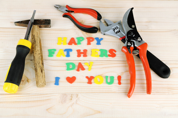 Happy Fathers Day (concept image with multicolor letters and tools, on wooden background) - Φωτογραφία, εικόνα