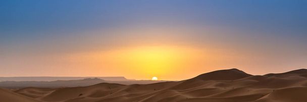 Merzouga in the Sahara Desert in Morocco. Afica. Web banner in panoramic view. - Photo, Image