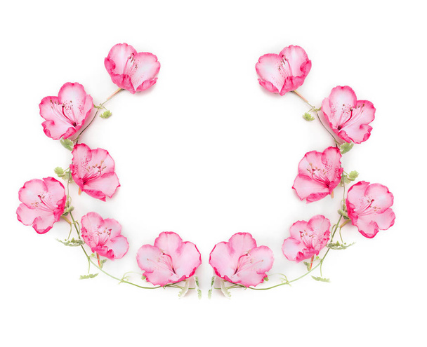 Floral wreath with pink flowers on white background, top view - Fotó, kép