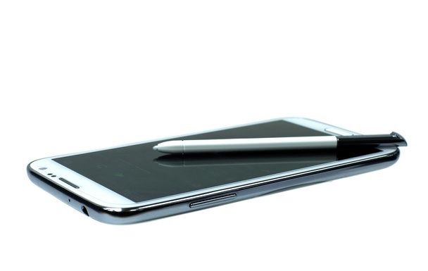 White mobile phone with stylus pen - Valokuva, kuva