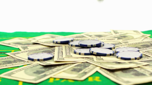 poker chips falling on dollars isolated on white, online betting concept  - Footage, Video