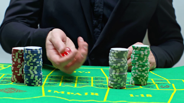 cropped view of man betting, throwing dice and celebrating triumph  - Footage, Video