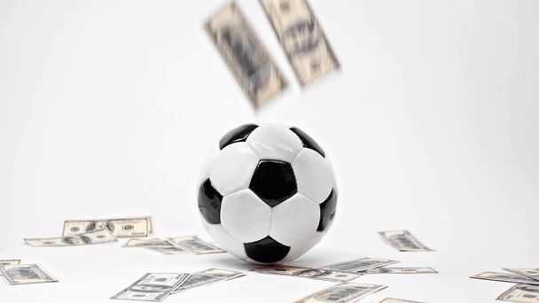 ホワイトでサッカーに近いドル紙幣、オンライン賭けの概念  - 映像、動画