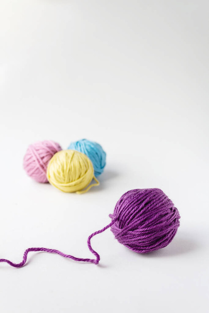 Close up photo of violet woolen ball. - Valokuva, kuva