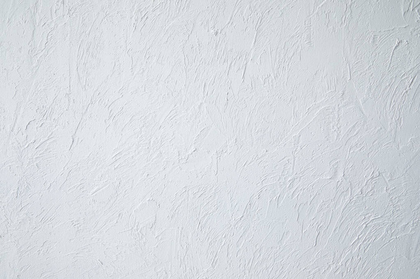 ざらざらした漆喰白壁の背景の抽象的な質感   - 写真・画像