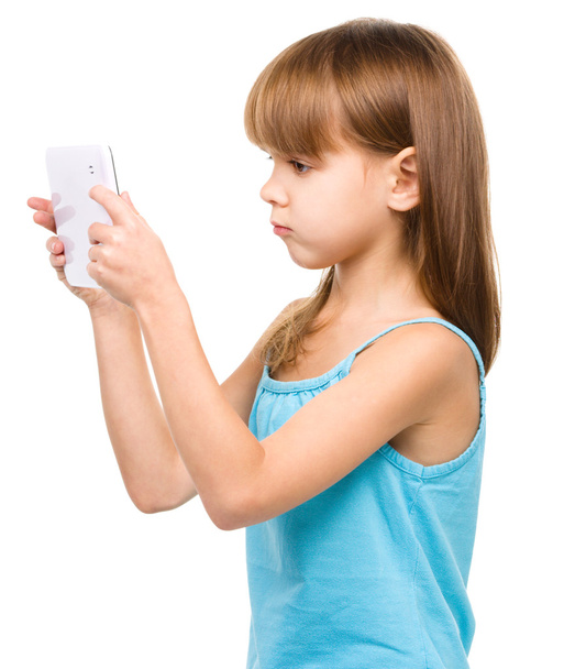 Young girl is using tablet - Foto, Imagen