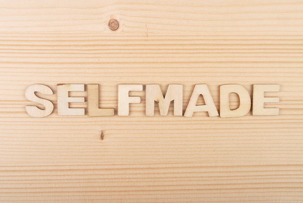 Term from wooden letters on pale wood - Photo, Image