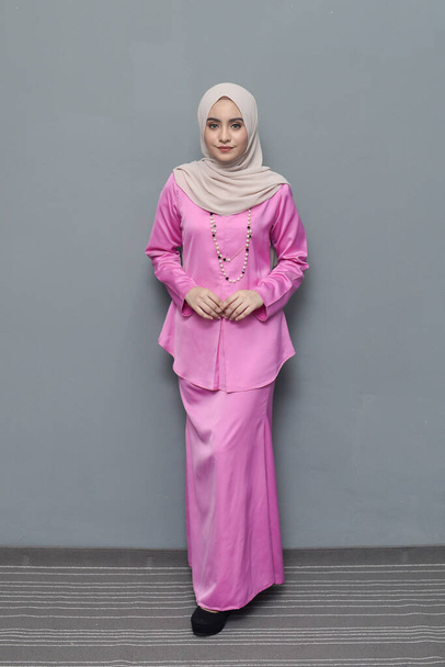 Hijab fashion.Cute Muslim girl wearing Hijab and traditional cloth.Fashion for eid celebration. - Photo, Image