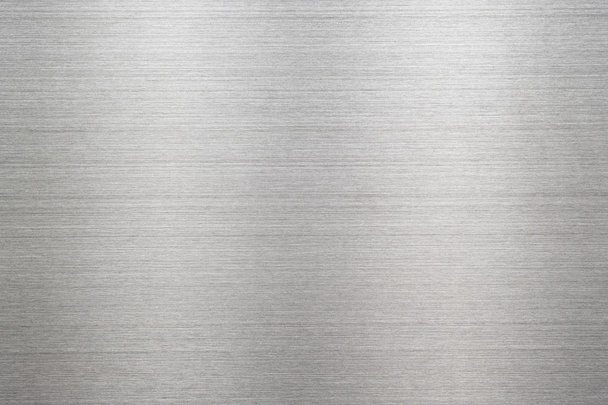 Textura abstracta de metal plateado de la placa de acero inoxidable cepillado con el reflejo de la luz
. - Foto, imagen