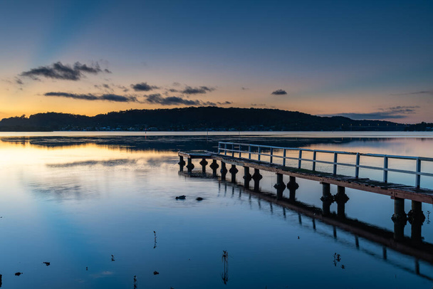 Sunrise Waterscape with Wharf at Woy Woy Waterfront on the Central Coast, NSW, Australia. - Photo, Image