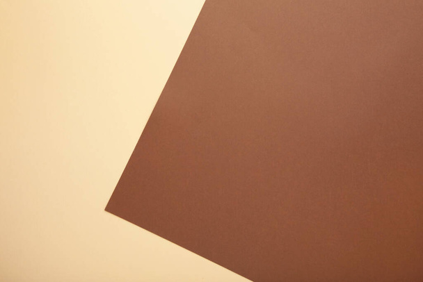 Multicolor background from a paper of brown and beige colors. Top view - Foto, imagen