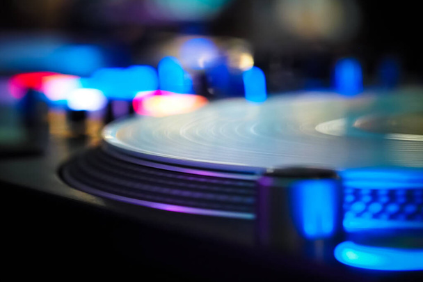 DJ vinyl players in dark nightclub, party in the dance club, DJ equipment, defocused  - Foto, Bild