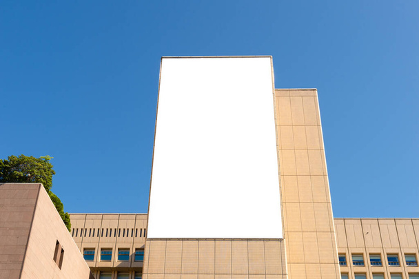 Large blank billboard on a street wall, banners with room to add your own text - Photo, Image