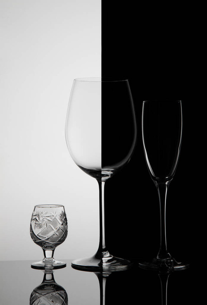 Three glass goblets on a black white background - Photo, Image