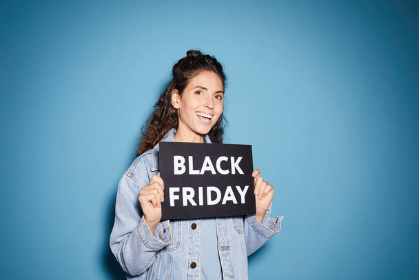 Woman is happy about Black Friday - Photo, Image