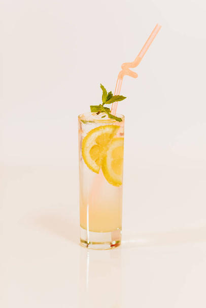 glass of fresh citrus cocktail on white background - Фото, зображення