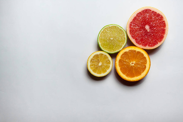 Citrus minimalism  on white background - Фото, изображение