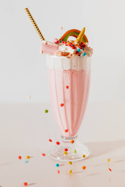 glass of strawberry milkshake isolated on white - Fotó, kép