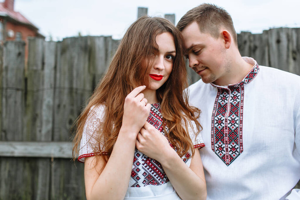 Reconstruction of traditional Russian dresses. Lovers in nature - Foto, Imagen