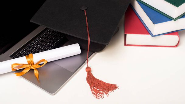 Graduation cap with laptop computer , Online education concept - Фото, изображение