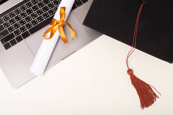 Graduation cap with laptop computer , Online education concept - Фото, изображение