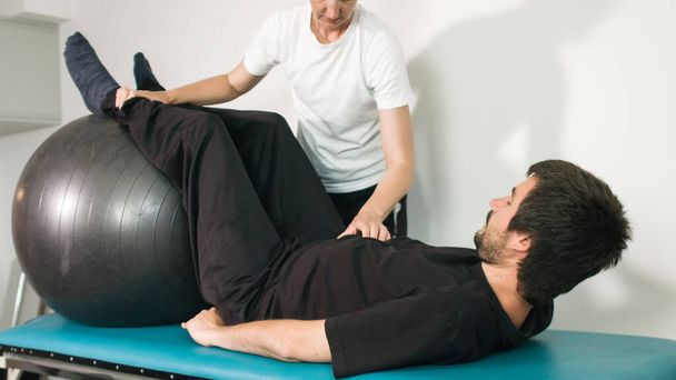 Physiotherapist with disabled person - Photo, image