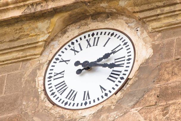 Roman numerals antique clock on a cathedral - Photo, Image
