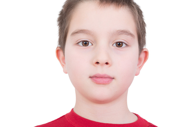 Handsome young boy with a serious expression - Zdjęcie, obraz