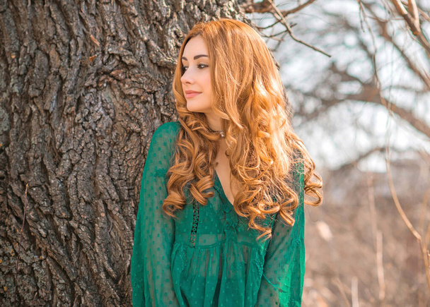 Redhead romantic girl in green blouse, boho style, concept of hair, wig - Foto, Imagem