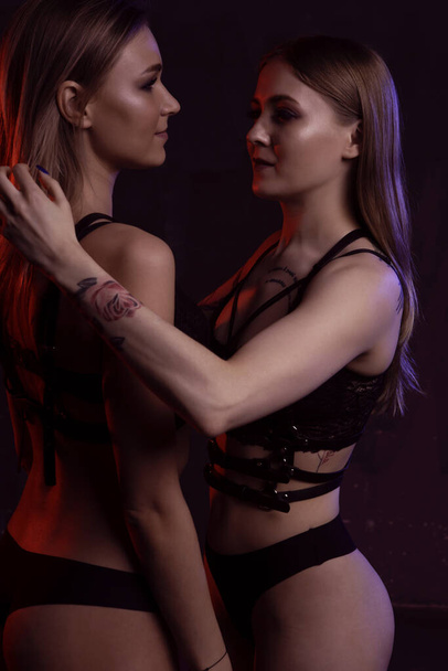 Lesbian women gently hugging in erotic foreplay game - Foto, Imagen