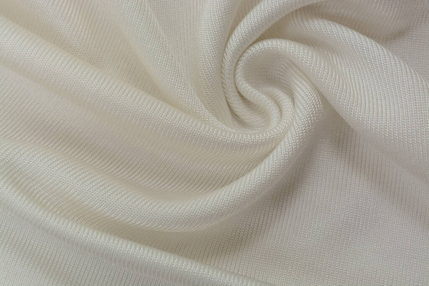 Background texture of ivory fabric, soft napped insulating fabric made of polyester, wavy pattern, top view - 写真・画像