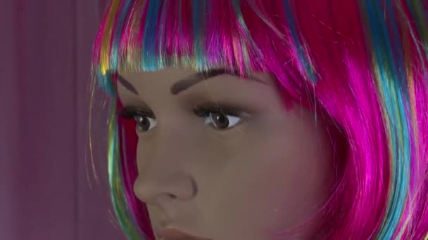 Female mannequin poses close-up for fashion video with multicolored wig 4K 50 fps - Footage, Video