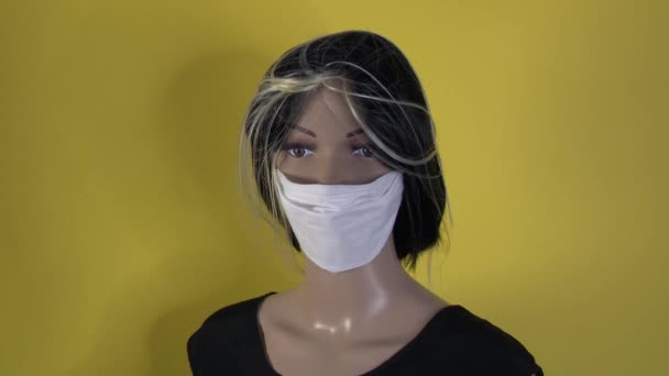 Female mannequin poses close-up for fashion video with a covid 19 antivirus mask. 4K 50 fps - Video