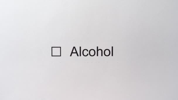 Checkbox Alcohol with a tick. Man hand draws a check mark in the field with the answer Alcohol. Alcohol testing. Sobriety test. - Footage, Video