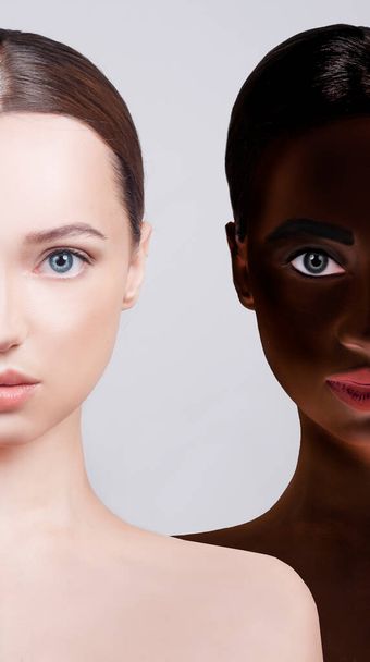 No to racism, the concept of sameness. Faces of two girls nearby, Caucasian-looking girl and African American. Beauty photo of girls of different nationalities, beauty. - Photo, image