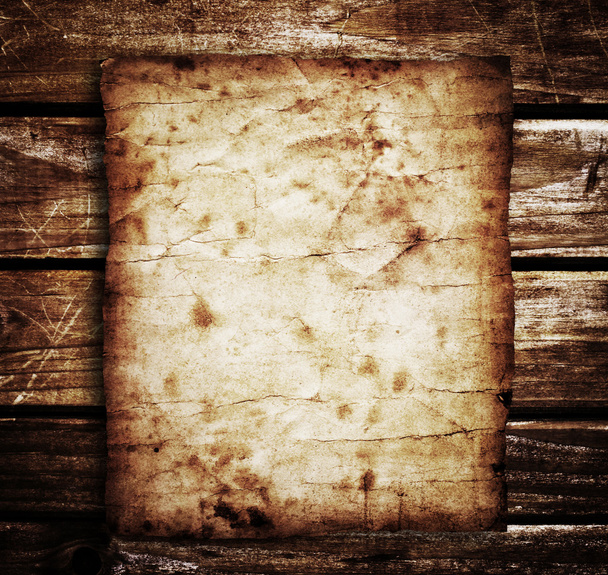 Old paper on the wood background - Foto, imagen
