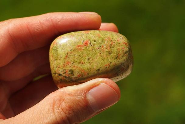 Unakite granite rock from India held in a hand - Photo, Image