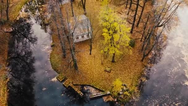 4K Old house at river bank. Autumn forest. Abandoned house on the shore of lake - Footage, Video