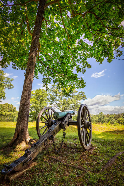 A lone cannon sitting near the edge of a forest on a Civil War battlefield. - Photo, Image