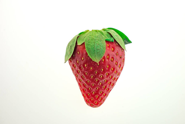 strawberry and half of strawberry isolated on a white background - Foto, afbeelding