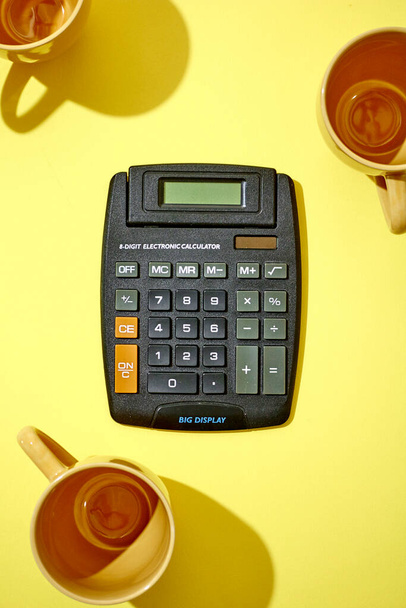 A studio photo of a black calculator - Photo, Image