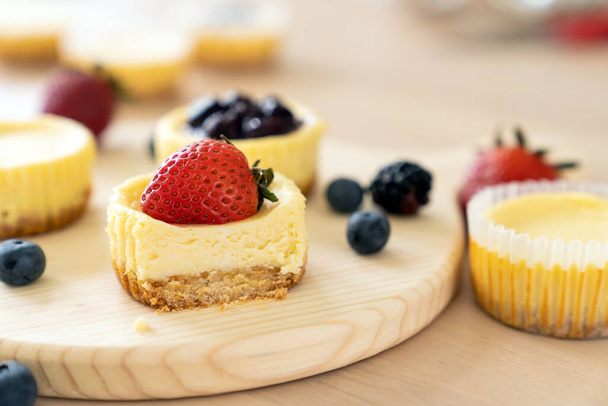 Mini cheesecake decorated with blueberry, blackberry and strawberry - Photo, Image